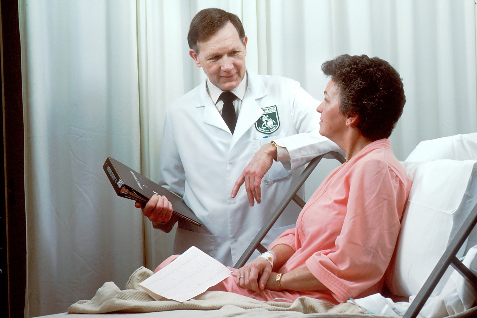woman discussing cancer with doctor