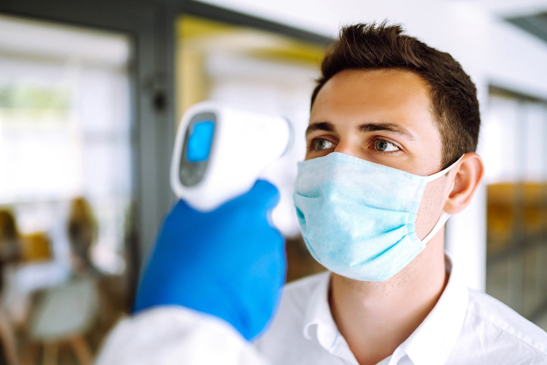 person getting checked by doctor for signs of sickness