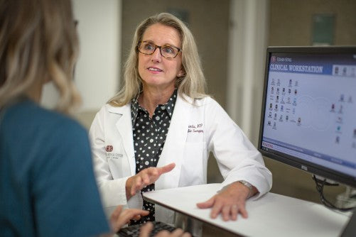 woman asking for dietary and lifestyle tips for surviving menopause to a doctor