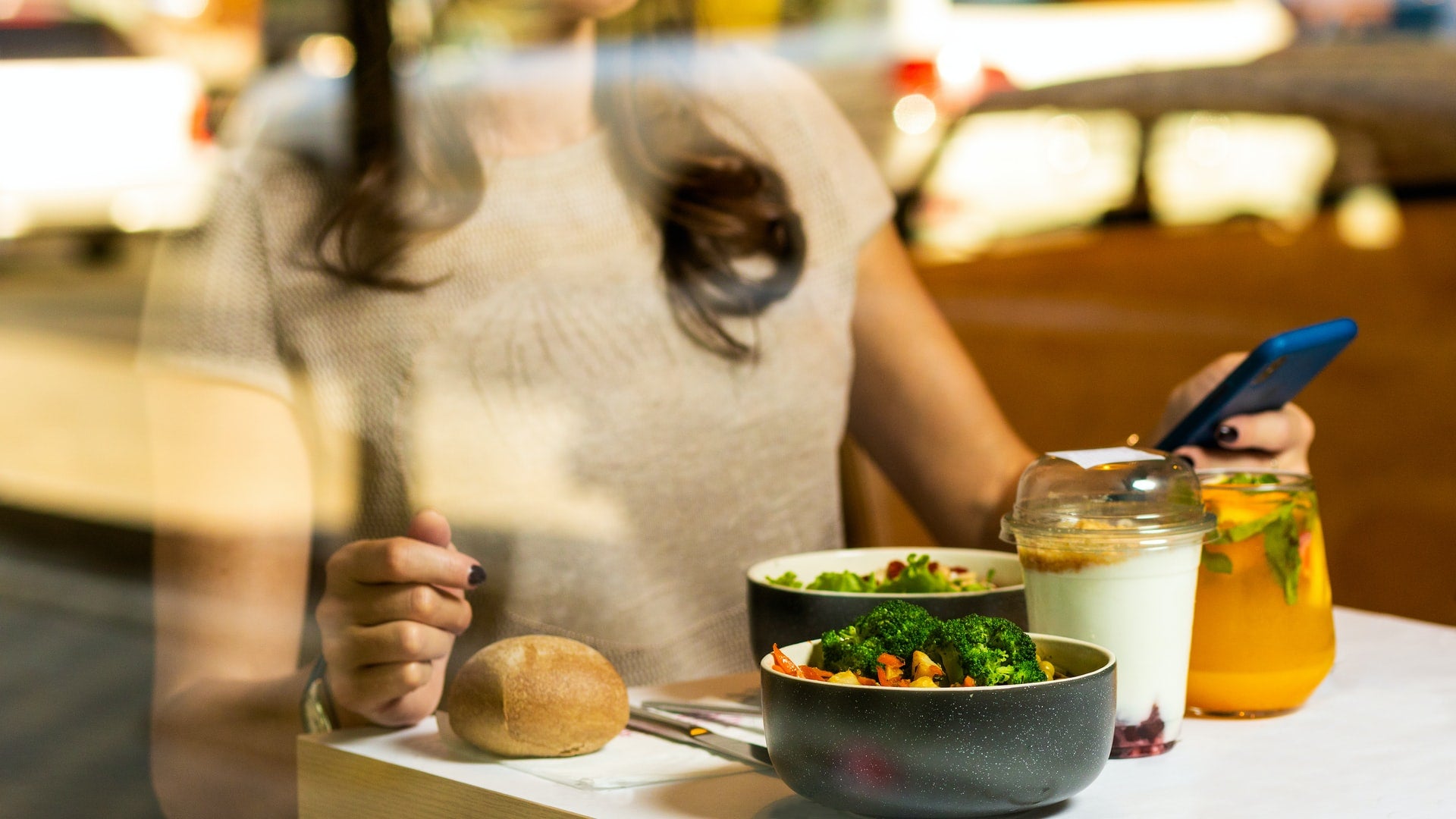 girl eating healthy food at a restaurant