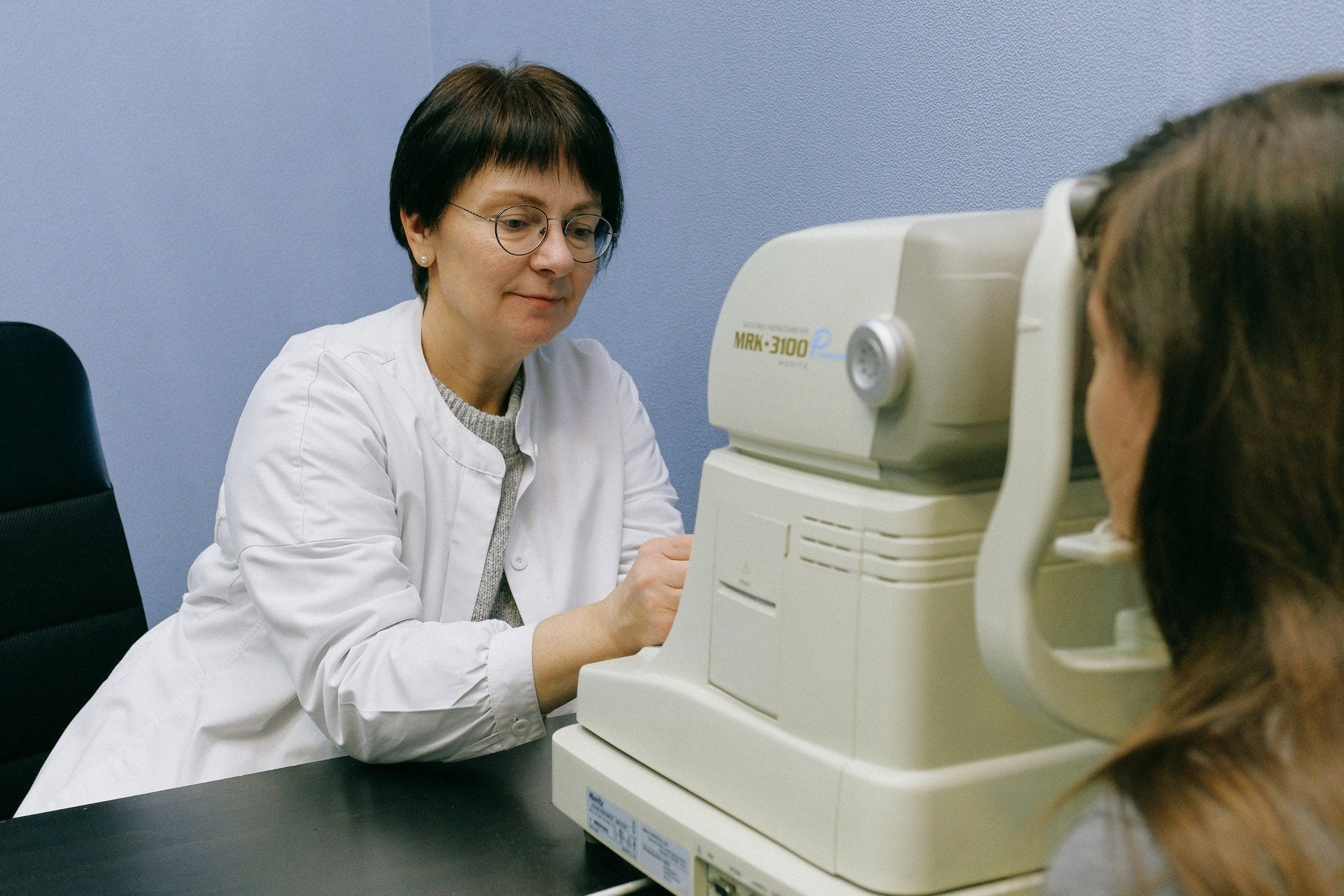 woman getting eye exam