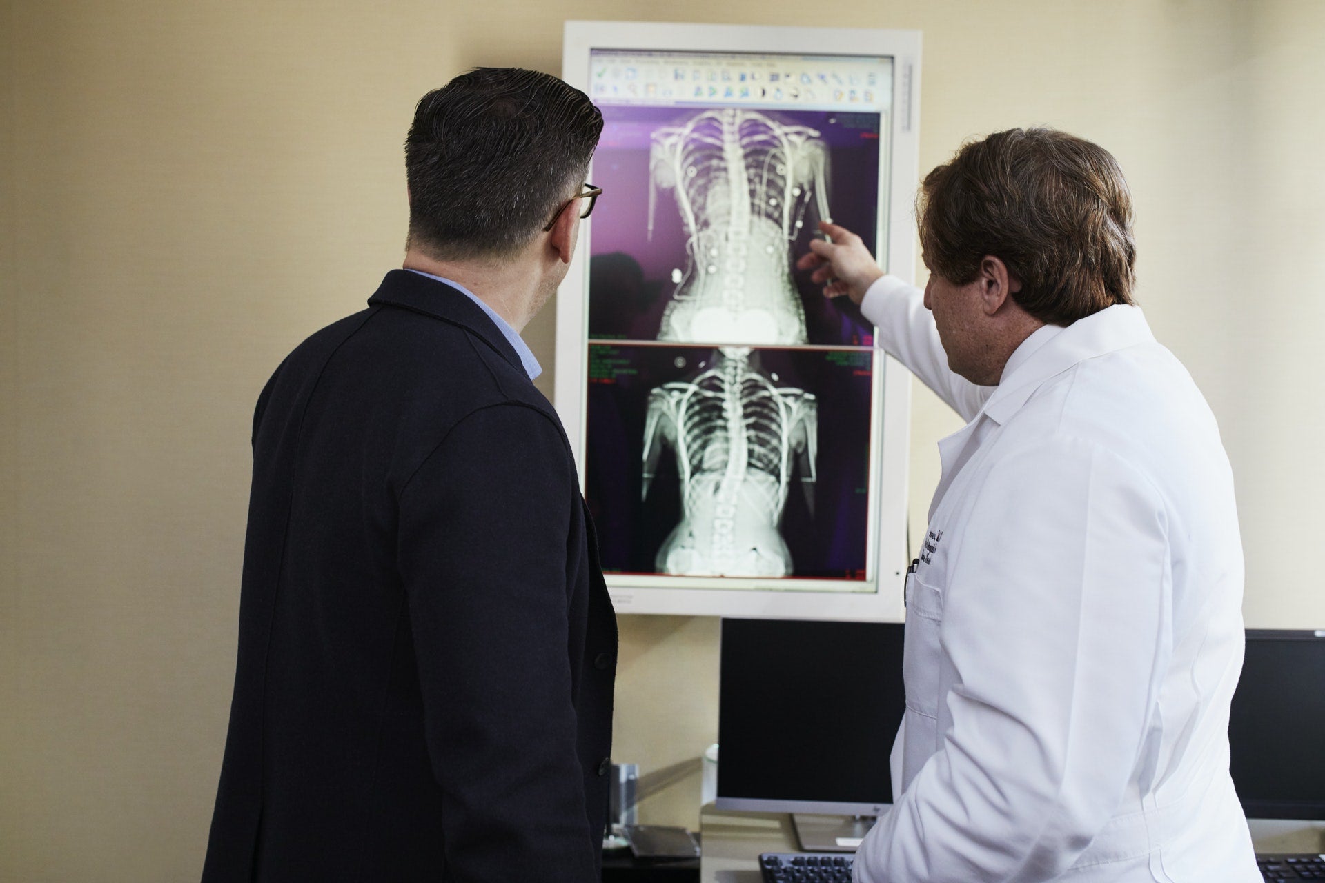 doctor and patient looking at x-ray