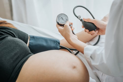 pregnant woman getting tested by a doctor positive for hazardous chemical