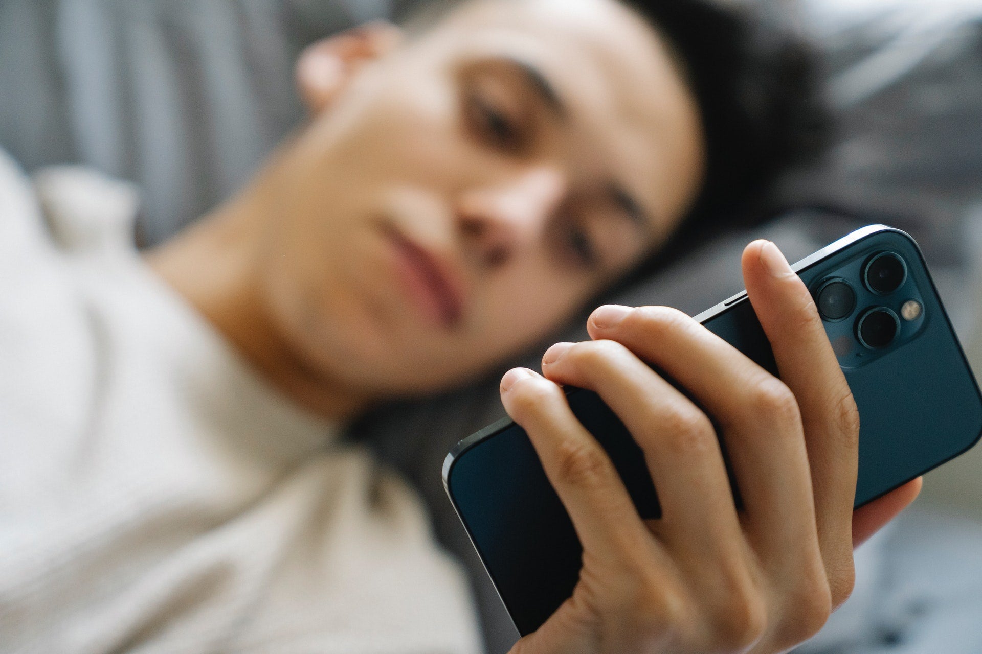 man looking at social media on phone