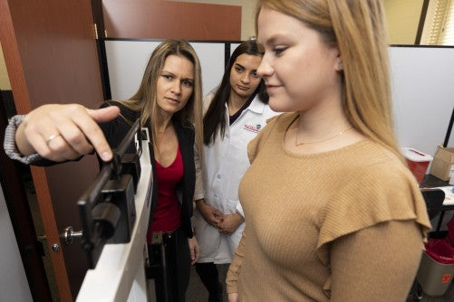 girl on scale for self-care