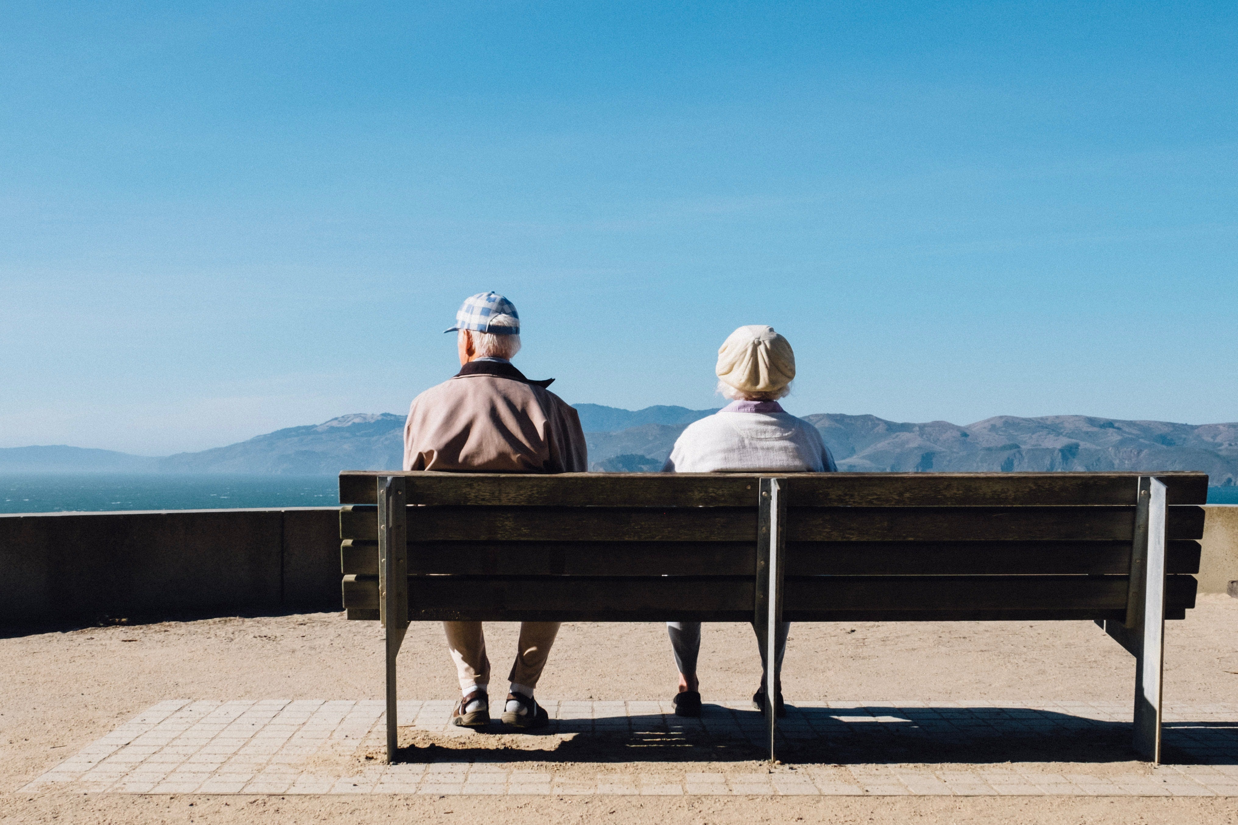 senior couple sitting on bench