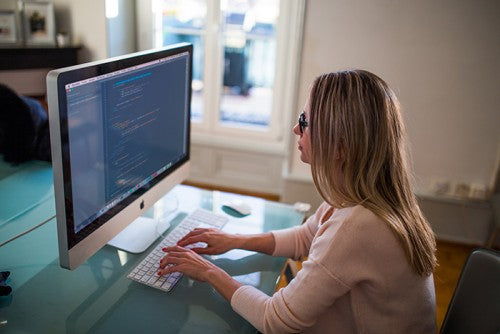 woman sitting at computer
