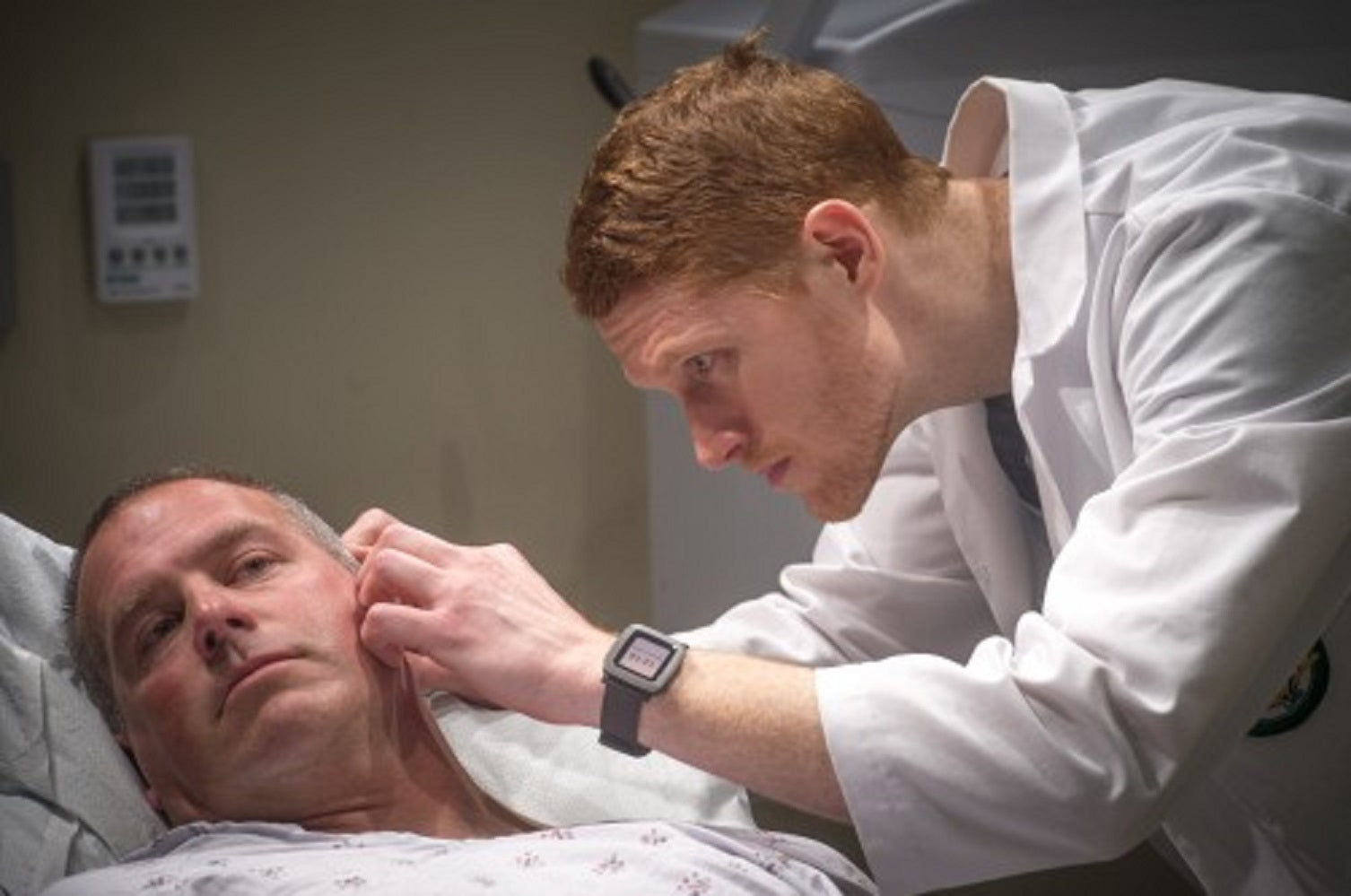 dermatologist checking patient for skin cancer