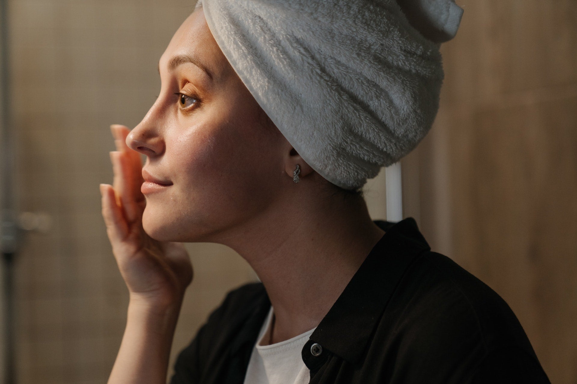 woman applying skincare products