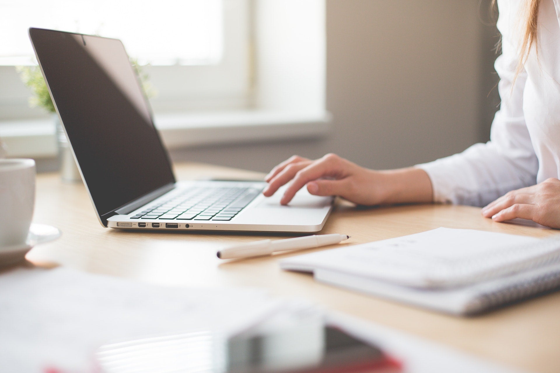 woman working remotely on computer