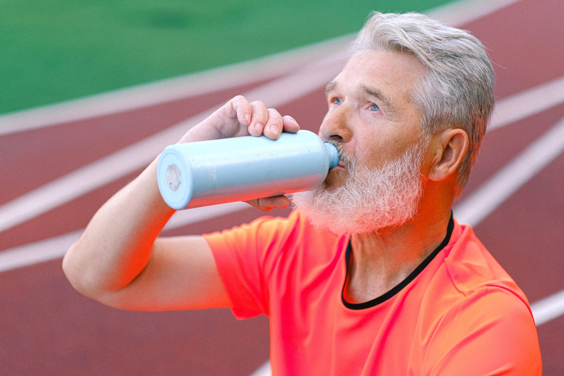 man drinking protein supplement