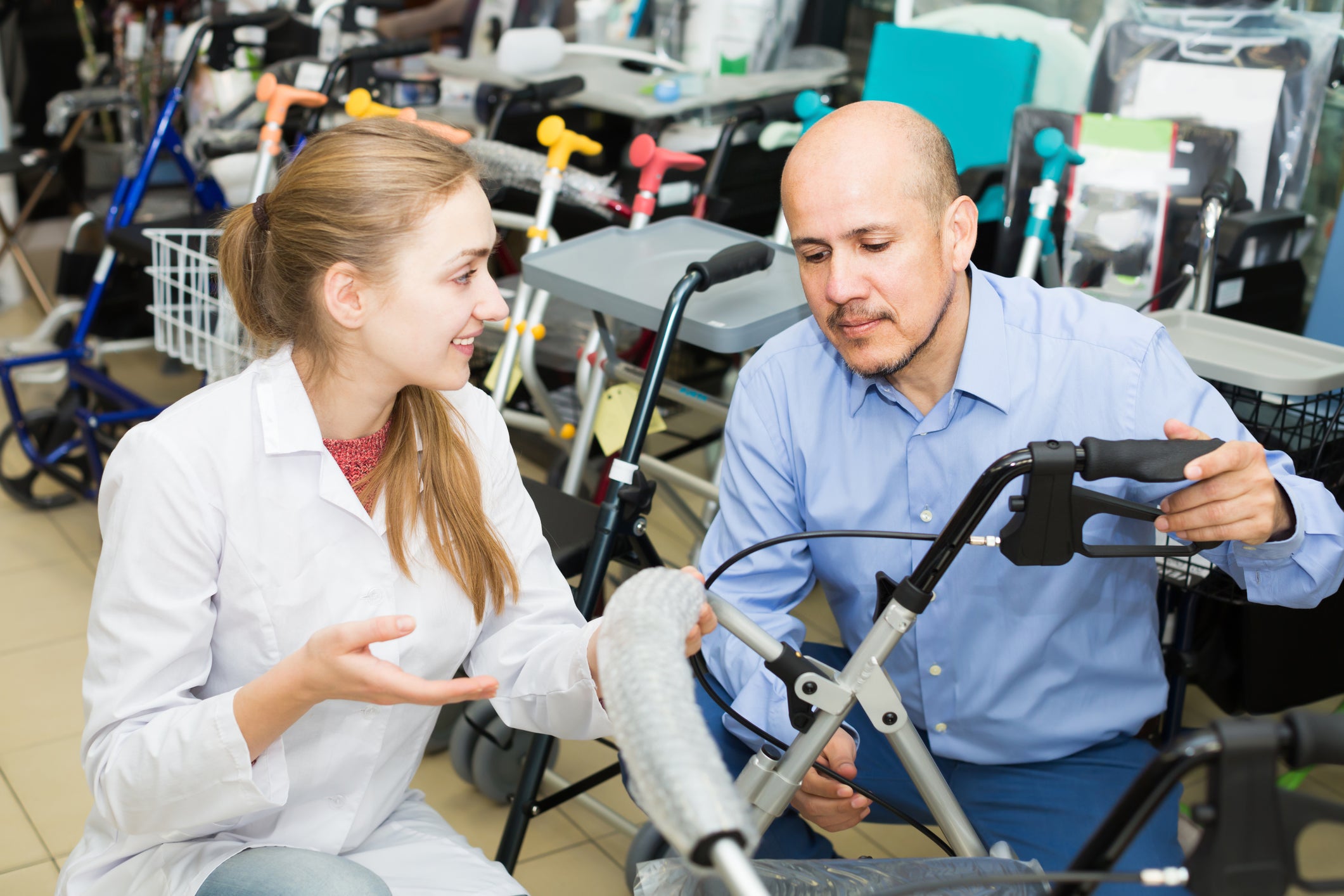 man considering portable electric wheelchair for travelling
