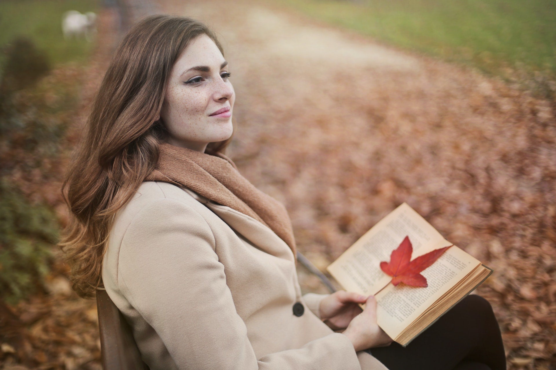 smiling woman reading book