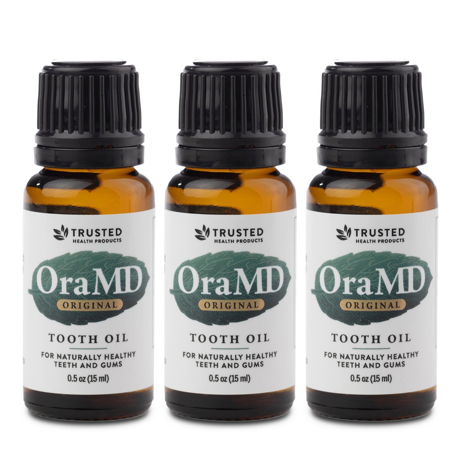Toothpaste Alternative three OraMD Original Strength Tooth Oil bottles