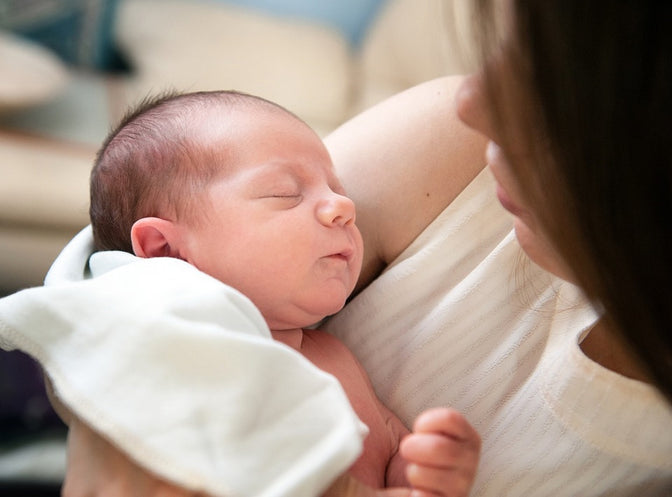 woman holding baby