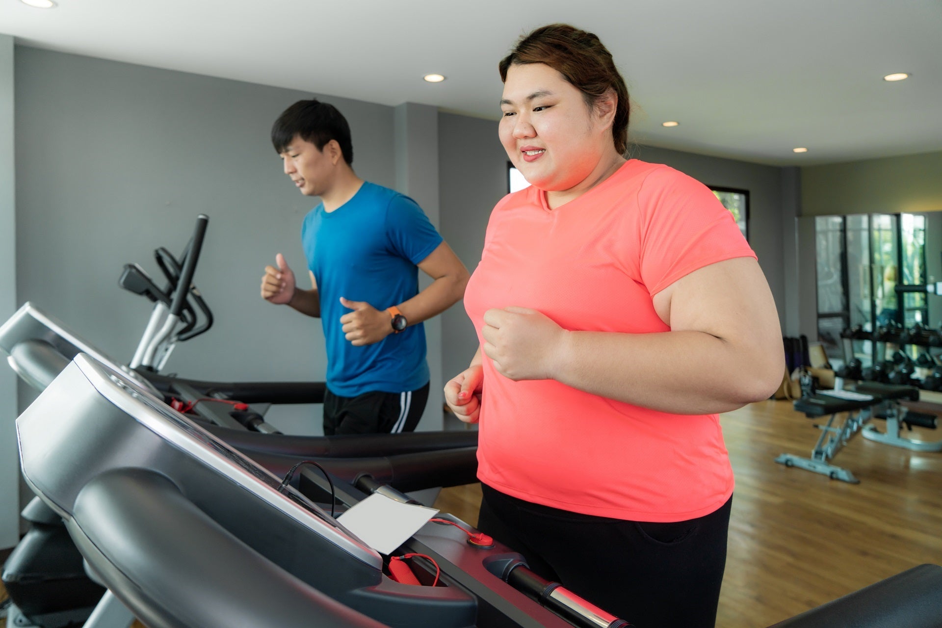 couple running on treadmill