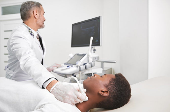 doctor using ultrasound machine to diagnose ailments and conditions