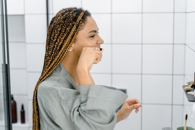 woman brushing her teeth