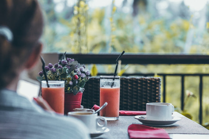 person drinking fruit smoothie for anxiety