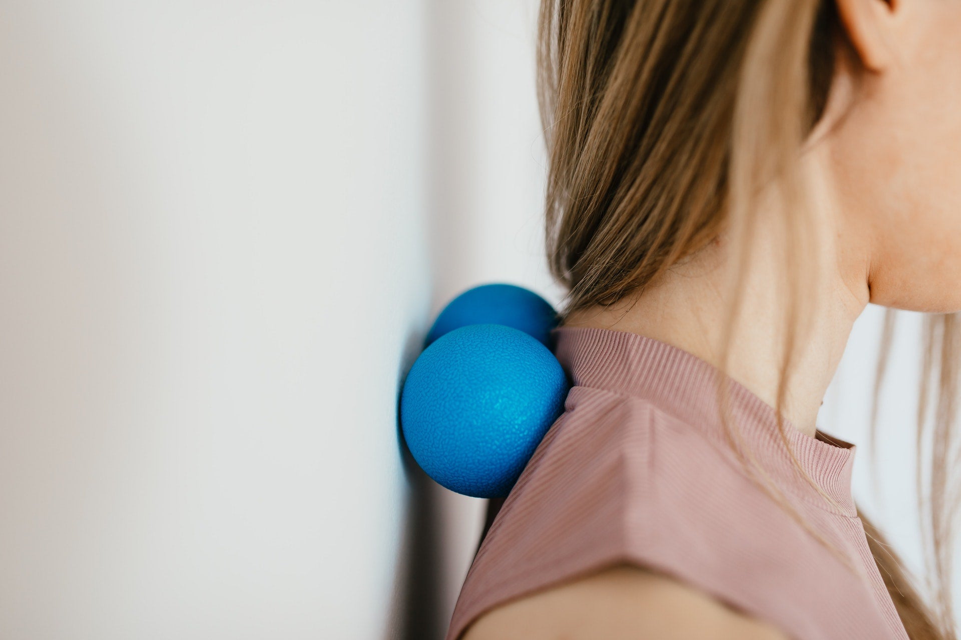 woman using foam roller for back exercise