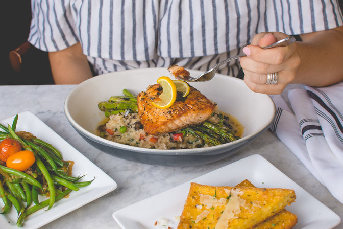 person eating fish to boost vitamin D