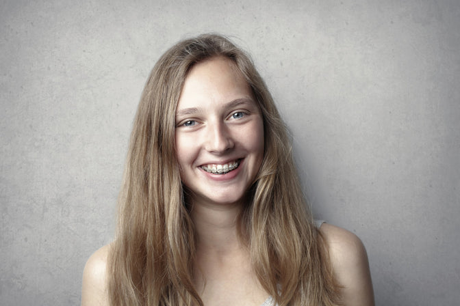 smiling girl with braces