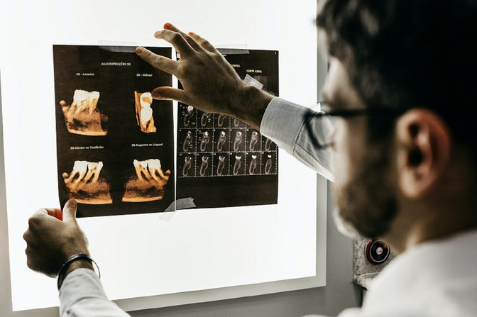 researcher showing a closer look at cavity-causing bacteria