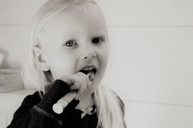 child brushing teeth