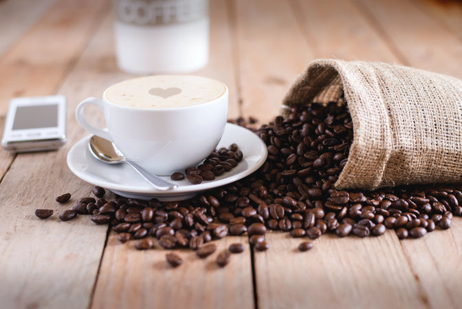 cup of coffee and bag of coffee beans