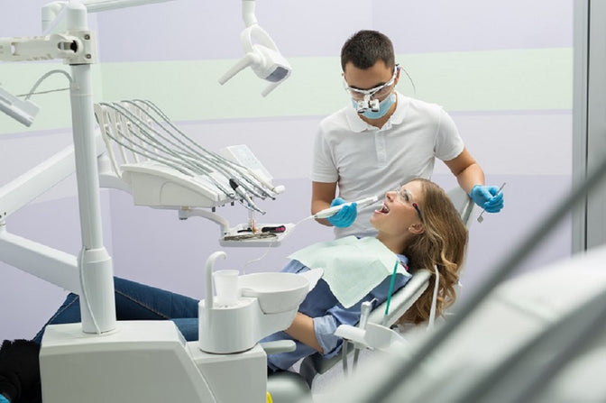 dentist and patient dental cleaning