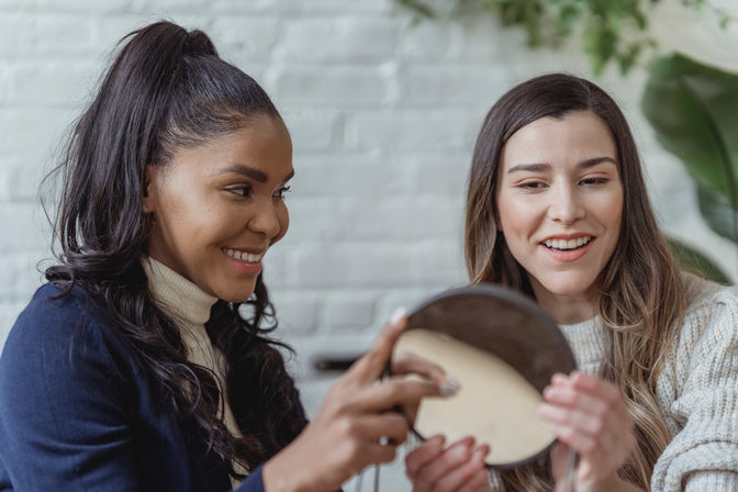 smiling girls discussing dental health