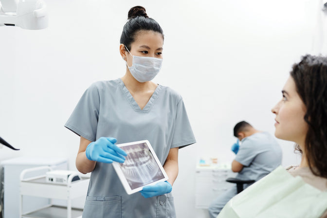 dentist discussing dental surgery with patient