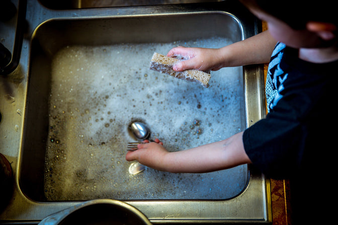 person washing dishes