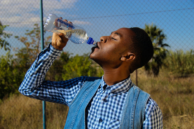 man drinking water dry mouth