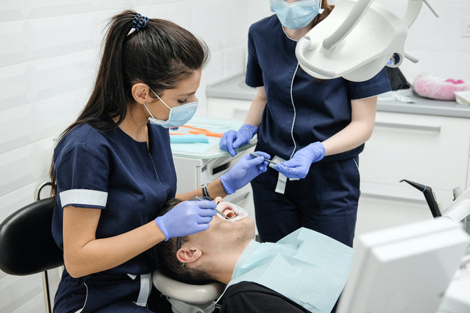 dentist discussing dry socket with patient