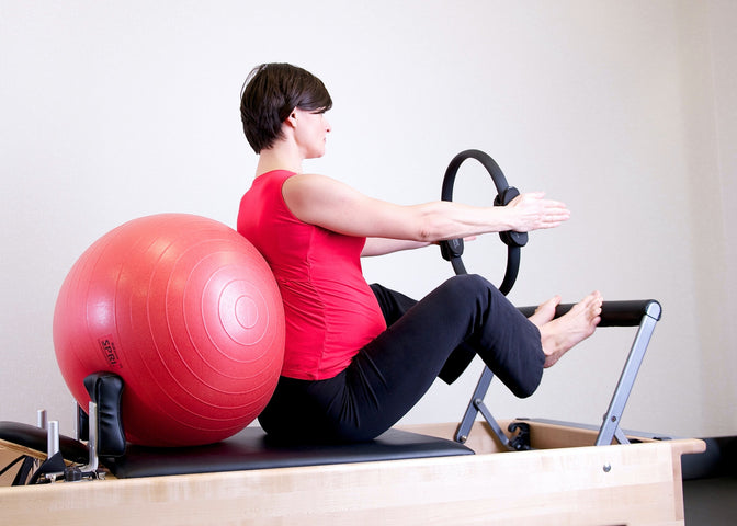 woman exercising with stability ball