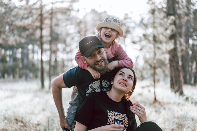 family walking in woods