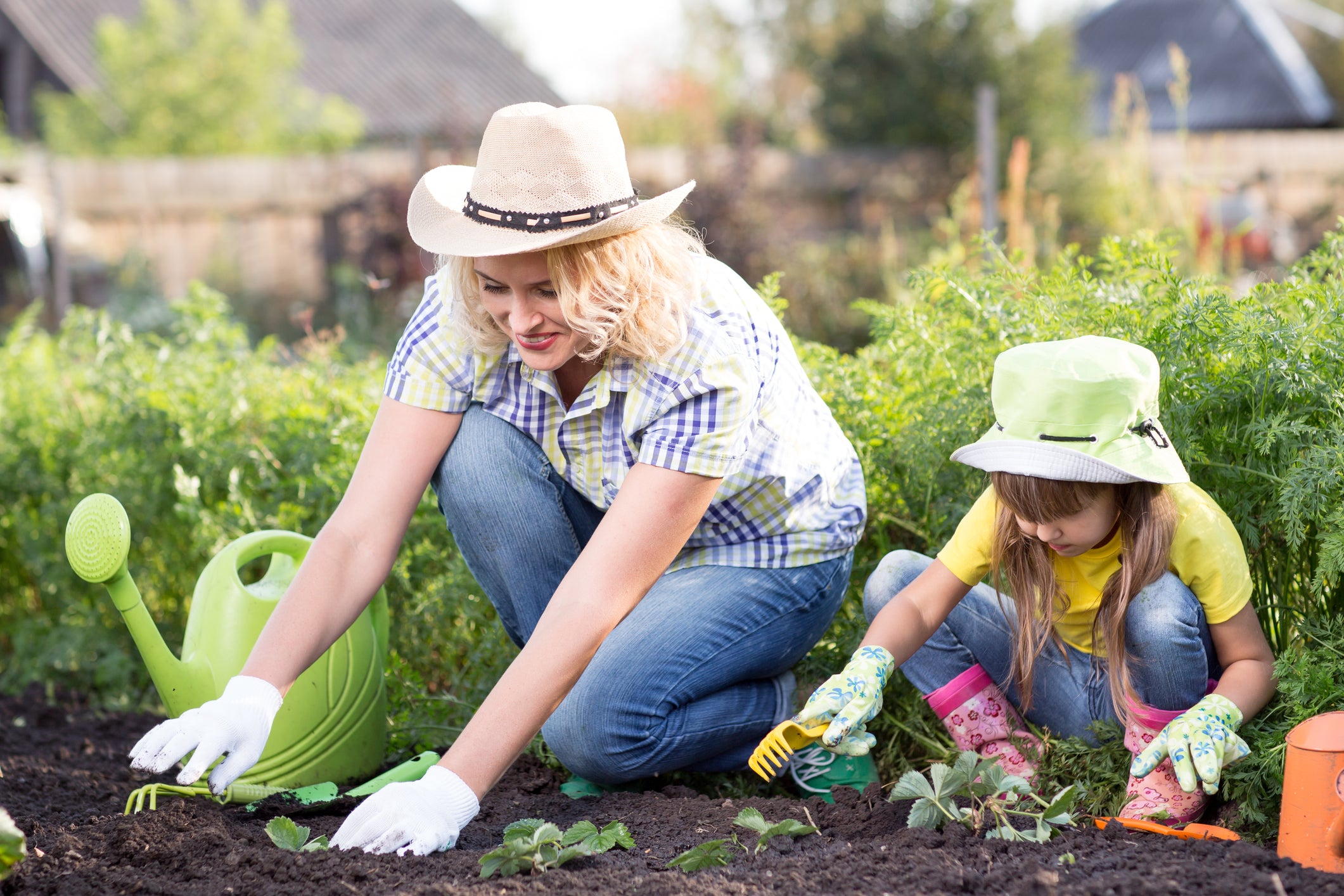 woman and child working in garden