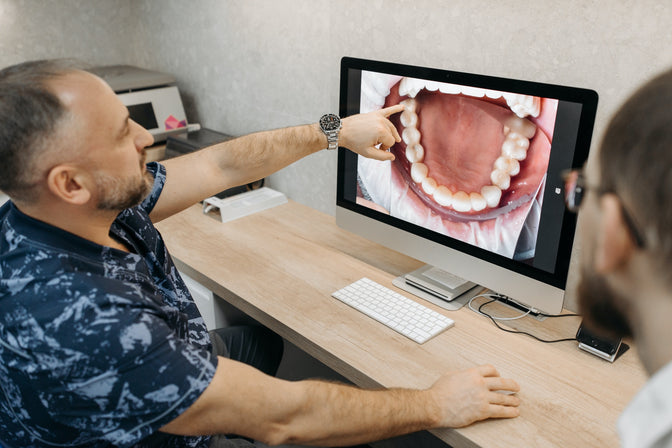 dentist discussing gingivitis with patient