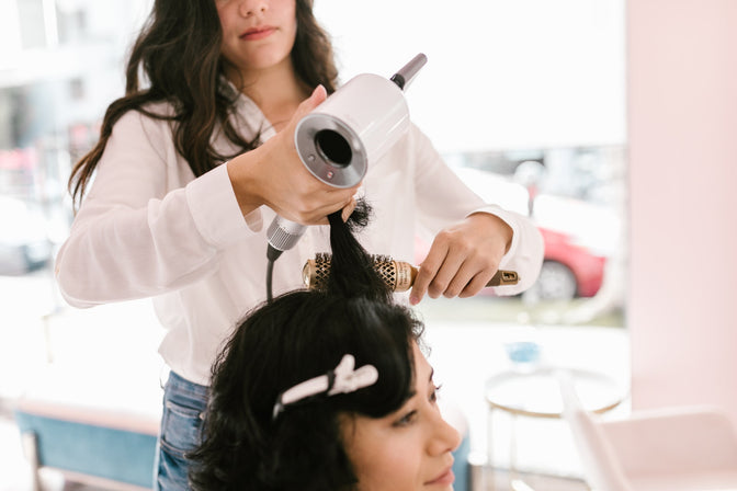 woman getting her hair cut