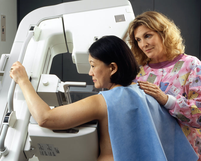 woman getting mammogram