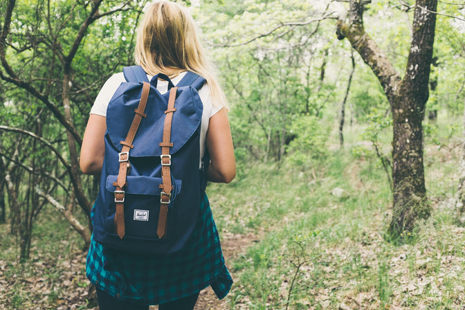 woman hiking to get healthier and happier