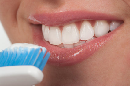 woman brushing teeth