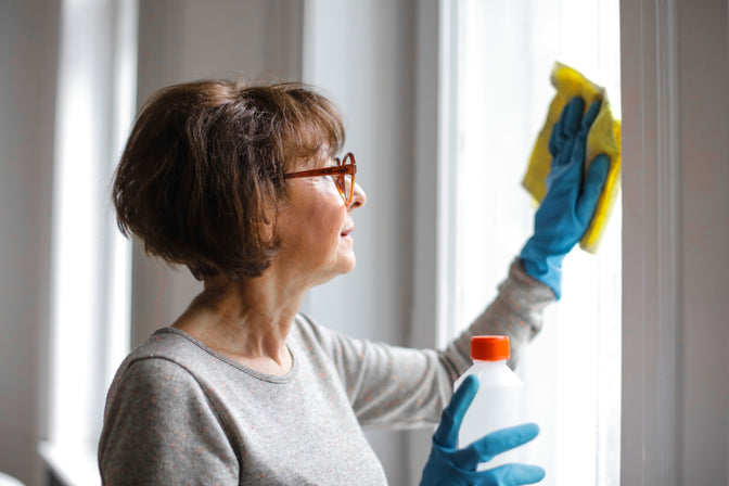 woman cleaning windows