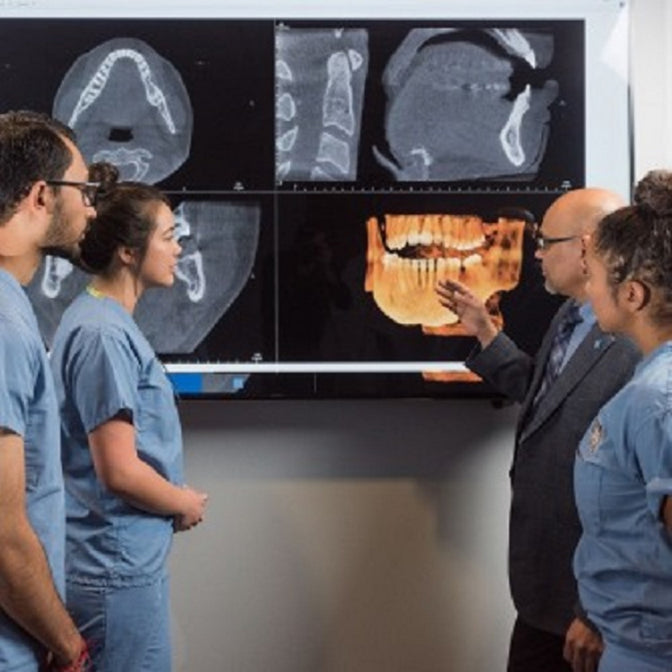 dentists discussing jaw surgery x-rays