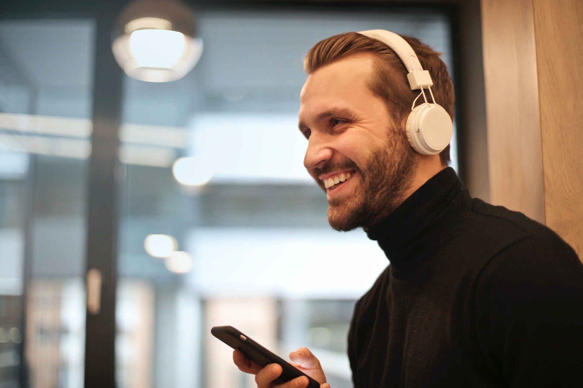man listening to music to boost well-being and fitness