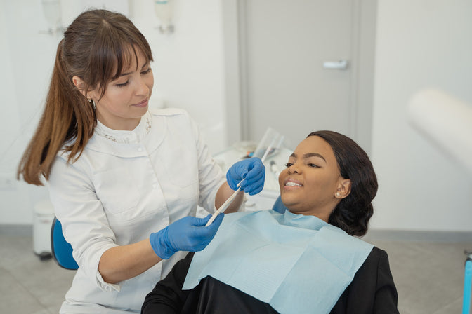 woman at dentist oral care routine