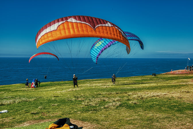 people hang gliding