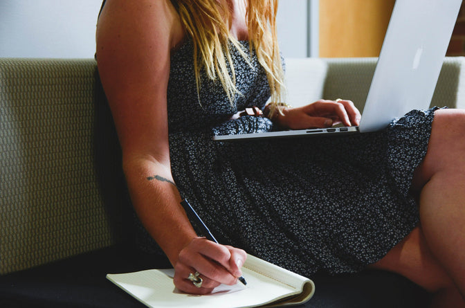 woman writing down resolutions