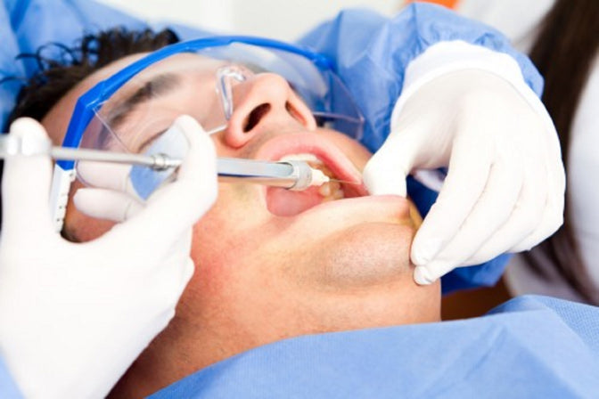 man getting a root canal